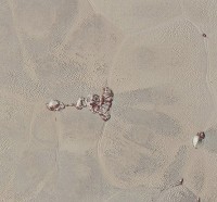 High-resolution images of Pluto taken by NASA’s New Horizons spacecraft just before closest approach on July 14, 2015, are the sharpest images to date of Pluto’s varied terrain—revealing details down to scales of 270 meters. In this 75-mile (120-kilometer) section of the taken from the larger, high-resolution mosaic above, the textured surface of the plain surrounds two isolated ice mountains. (NASA/JHUAPL/SWRI)