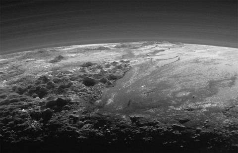 Closer Look: Majestic Mountains and Frozen Plains: Just 15 minutes after its closest approach to Pluto on July 14, 2015, NASA’s New Horizons spacecraft looked back toward the sun and captured this near-sunset view of the rugged, icy mountains and flat ice plains extending to Pluto’s horizon. (NASA/JHUAPL/SwRI)