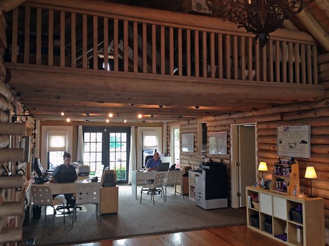 Interior of the Providence Auto Group’s log cabin sales floor.