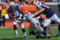 Tennessee Titans running back Bishop Sankey (20) runs the ball as Cleveland Browns middle linebacker Karlos Dansby (56) makes the tackle during the second half at FirstEnergy Stadium. The Browns won 28-14. (Mandatory Credit: Ken Blaze-USA TODAY Sports)