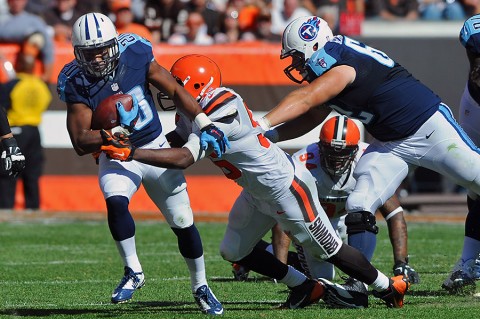 Tennessee Titans running back Bishop Sankey (20) runs the ball as Cleveland Browns middle linebacker Karlos Dansby (56) makes the tackle during the second half at FirstEnergy Stadium. The Browns won 28-14. (Mandatory Credit: Ken Blaze-USA TODAY Sports) Tennessee Titans running back Bishop Sankey (20) runs the ball as Cleveland Browns middle linebacker Karlos Dansby (56) makes the tackle during the second half at FirstEnergy Stadium. The Browns won 28-14. (Mandatory Credit: Ken Blaze-USA TODAY Sports)