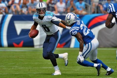 Tennessee Titans quarterback Marcus Mariota (8) scrambles to avoid Indianapolis Colts strong safety Mike Adams (29) during the first half at Nissan Stadium. (Jim Brown-USA TODAY Sports)