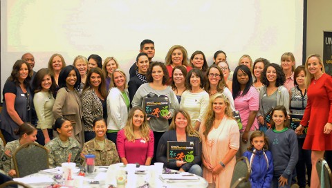 Family members with the 2nd Brigade Combat Team, 101st Airborne Division (Air Assault) pose for a photo during the “spark your inner fire” workshop at the Family Resource Center, Sept. 30, 2015. (U.S. Army Staff Sgt. Sierra A. Fown, 2nd Brigade Combat Team, 101st Airborne Division (Air Assault) Public Affairs)