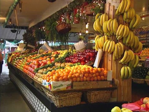 Farmers' market produce stand showing assorted fruits and vegetables. (American Heart Association)