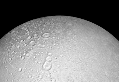 This view from NASA's Cassini spacecraft shows battered terrain around the north pole of Saturn's icy moon Enceladus. Craters crowd and overlap each other, each one recording an impact in the moon's distant past. (NASA/JPL-Caltech/Space Science Institute)