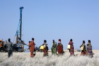 Radar Technologies International’s WATEX System uses Landsat data, which contains information on surface topography and rock chemistry, to help locate underground water. Pictured here are Turkana women coming with containers to gather newly discovered water from a drilled well in the Lotikipi basin. (Radar Technologies International)