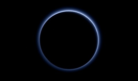 Pluto’s Blue Sky: Pluto’s haze layer shows its blue color in this picture taken by the New Horizons Ralph/Multispectral Visible Imaging Camera (MVIC). The high-altitude haze is thought to be similar in nature to that seen at Saturn’s moon Titan. The source of both hazes likely involves sunlight-initiated chemical reactions of nitrogen and methane, leading to relatively small, soot-like particles (called tholins) that grow as they settle toward the surface. (NASA/JHUAPL/SwRI)