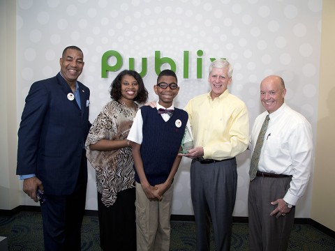 “March of Dimes National Ambassador Family Todd Jackson, Elise Jackson and Elijah Jackson recently presented Publix CEO Ed Crenshaw and President Todd Jones with the Crystal Award for being named the #2 March for Babies National Team in 2014.”