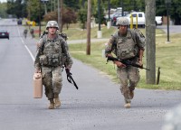 Spc. Kyle Little, a medic with 2nd Battalion, 44th Air Defense Artillery Regiment, 101st Airborne Division Sustainment Brigade, and Sgt. Gaines Sumrall, a medic with 101st Airborne Division Artillery, jog the last leg of the final road march during the 101st Airborne Division Best Medic Competition at Fort Campbell, Ky., Sept. 25, 2015. Little and Sumrall will represent the 101st Airborne Division at the Command Sgt. Maj. Jack L. Clark Jr. Best Medic Competition at Fort Sam Houston, Texas, in November. (Sgt. William White, 101st Airborne Division (Air Assault) Public Affairs)