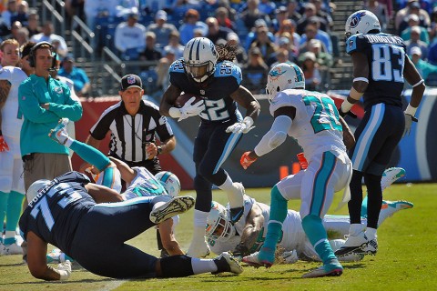 Tennessee Titans running back Dexter McCluster (22) leaps to avoid a tackle against the Miami Dolphins during the first half at Nissan Stadium October 18th, 2015 . (Jim Brown-USA TODAY Sports)