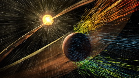 Artist’s rendering of a solar storm hitting Mars and stripping ions from the planet's upper atmosphere. (NASA/GSFC)