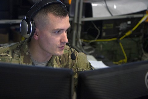 Sgt. John Scheffler, an infantryman with 101st Airborne Division (Air Assault), communicates with another unit to help create a common operating picture of the battlefield during Warfighter Exercise 16-02 at Fort Campbell, Ky., Nov. 19. Scheffler is a Wisconsin National Guard Soldier whose unit joined the 101st for the exercise, creating the first multi-component unit to participate in WFX. (Sgt. William White, 101st Airborne Division Public Affairs)