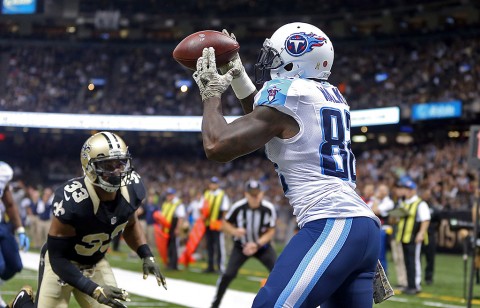 Tennessee Titans tight end Delanie Walker (82) makes a 2-yard touchdown catch while defended by New Orleans Saints strong safety Jamarca Sanford (33) in the second quarter of their game at the Mercedes-Benz Superdome. (Chuck Cook-USA TODAY Sports)