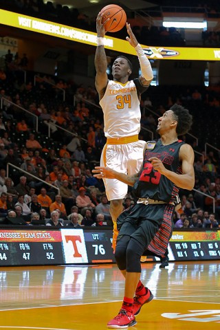 Tennessee Volunteers guard Devon Baulkman (34) shoots the ball as Gardner Webb Runnin Bulldogs guard Adonis Burbage (23) looks on during the second half at Thompson-Boling Arena. The Volunteers won 89-64. (Randy Sartin-USA TODAY Sports)