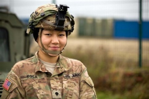 Soldiers serving in Germany discuss values, service, and sacrifice as Veterans Day, observed Nov. 11, approaches. Here, Army Spc. Judy Mera Rosa prepares to perform preventive maintenance checks and services with her comrade Sgt. Charles Roseboro during Exercise Combined Resolve V at the Joint Multinational Readiness Center in Hohenfels, Germany, Nov. 7, 2015. (Courtesy photo)