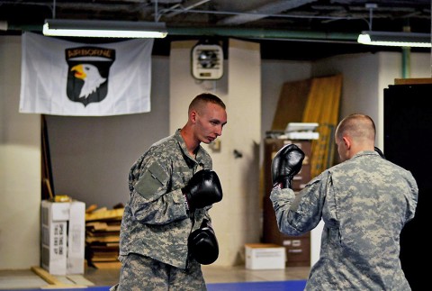 Spc. Christian L. Nielsen and Spc. Joshua M. Bareiszis, 2nd Brigade Combat Team, 101st Airborne Division (Air Assault), practice striking techniques at the 2nd Brigade Combat Team Combatives School here, Dec. 2, 2015. (U.S. Army Staff Sgt. Sierra A. Fown, 2nd Brigade Combat Team, 101st Airborne Division (Air Assault) Public Affairs)