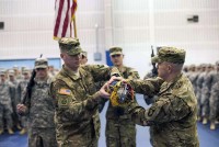 At a color casing ceremony Feb. 27, 2015, at the Freedom Fighter Gym, “Bulldogs” command team, Lt. Col. Eric Beaty, commander of 1st Battalion, 327th Infantry Regiment, 1st Brigade Combat Team, 101st Airborne Division (Air Assault), and Command Sgt. Maj. Micheal Coffey, command sergeant major for the battalion, cased the battalion colors. Historically, the battalion colors lead a unit into battle and remain a symbol of continuity for Soldiers deploying forward. The casing symbolizes the start of the “Bulldogs” next rendezvous with destiny. (Sgt. Samantha Parks, 1st Brigade Combat Team)