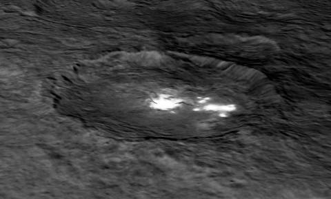 An image of Occator Crater draped over a digital terrain model provides a 3-D-like perspective view of the impact structure. (NASA/JPL-Caltech/UCLA/MPS/DLR/IDA)