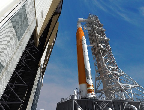 This artist concept depicts the Space Launch System rocket rolling out of the Vehicle Assembly Building at NASA's Kennedy Space Center. SLS will be the most powerful rocket ever built and will launch the agency’s Orion spacecraft into a new era of exploration to destinations beyond low-Earth orbit. (NASA/Marshall Space Flight Center)