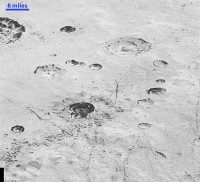 Layered Craters and Icy Plains: This highest-resolution image from NASA’s New Horizons spacecraft reveals new details of Pluto’s rugged, icy cratered plains, including layering in the interior walls of many craters. (NASA/JHUAPL/SwRI)