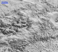 Pluto’s ‘Badlands’: This highest-resolution image from NASA’s New Horizons spacecraft shows how erosion and faulting have sculpted this portion of Pluto’s icy crust into rugged badlands topography. (NASA/JHUAPL/SwRI)
