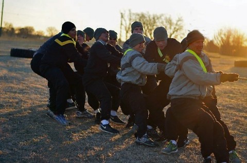 Lt. Col. Shawn Umbrell, commander, 1st Battalion, 502nd Infantry Regiment, 2nd Brigade Combat Team, 101st Airborne Division (Air Assault) leads Soldiers within his battalion during a tug-of-war game here, Jan. 13. The tug-of-war was a part of the chaplain’s challenge- an event that was geared to incorporate both physical training and the Value of Life. (Staff Sgt. Sierra A. Fown, 2nd Brigade Combat Team, 101st Airborne Division (Air Assault)