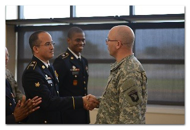 Sgt. Maj. Jesse E. Ruth, G1 sergeant major, 101st Airborne Division (Air Assault) presents a coin to Spc. David Rosario, 1st Squadron, 75th Calvary Regiment, 2nd Brigade Combat Team, 101st Airborne Division (Air Assault) following his selection of the division’s AG Soldier of the quarter. (U.S. Army Staff Sgt. Sierra A. Fown, 2nd Brigade Combat Team, 101st Airborne Division (Air Assault) Public Affairs) Sgt. Maj. Jesse E. Ruth, G1 sergeant major, 101st Airborne Division (Air Assault) presents a coin to Spc. David Rosario, 1st Squadron, 75th Calvary Regiment, 2nd Brigade Combat Team, 101st Airborne Division (Air Assault) following his selection of the division’s AG Soldier of the quarter. (U.S. Army Staff Sgt. Sierra A. Fown, 2nd Brigade Combat Team, 101st Airborne Division (Air Assault) Public Affairs)