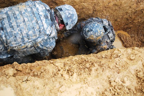 U.S. Army? Soldiers, assigned to the 52nd Ordnance Group (Explosive Ordnance Disposal), use a hand-held scanner to locate buried training ordnance and subsequently identify and render it safe during an annual explosive ordnance disposal competition held on Fort Knox, KY, April 16th, 2015. (U.S. Army photo by Rachael Tolliver)