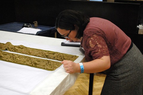 APSU student Macon St. Hilaire examining embroidery during her trip to London.