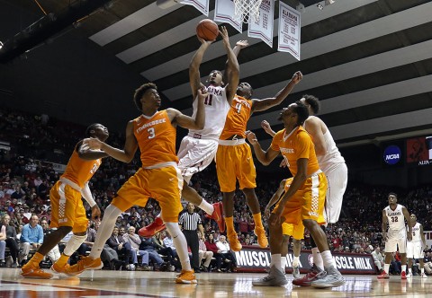 Alabama Crimson Tide forward Shannon Hale (11) goes up for a shot and is fouled by Tennessee Volunteers forward Armani Moore (4) during the second half at Coleman Coliseum. Alabama won 63-57. (Butch Dill-USA TODAY Sports)