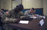 Sgt. David Barner, an automated logistical specialist with 1st Battalion, 187th Infantry Regiment, 3rd Brigade Combat Team, 101st Airborne Division (Air Assault), finishes a course evaluation after graduating the Master Fitness Trainer Course at Fort Campbell, Ky., Feb. 2, 2016. Barner is one of nearly 40 101st Soldiers who graduated the course. (Sgt. William White, 101st Airborne Division Public Affairs)