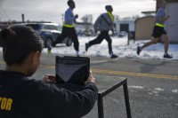 Sgt. 1st Class Liela Cowhig, a senior instructor for the Master Fitness Training Course, uses an application to evaluate Soldiers’ running technique during an MFTC at Fort Campbell, Ky., Jan. 26, 2016. Cowhig and the other MFTC instructors spent two weeks at Fort Campbell teaching 101st Airborne Division (Air Assault) Soldiers about nutrition and exercise science. (Sgt. William White, 101st Airborne Division Public Affairs)