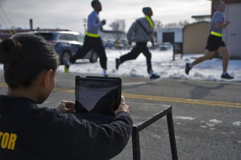 Sgt. 1st Class Liela Cowhig, a senior instructor for the Master Fitness Training Course, uses an application to evaluate Soldiers' running technique during an MFTC at Fort Campbell, Ky., Jan. 26, 2016. Cowhig and the other MFTC instructors spent two weeks at Fort Campbell teaching 101st Airborne Division (Air Assault) Soldiers about nutrition and exercise science. (Sgt. William White, 101st Airborne Division Public Affairs)