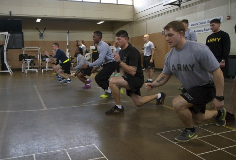 Students of the Master Fitness Trainer Course conduct the lunge walk during the Physical Readiness Training execution phase of the MFTC at Fort Campbell, Ky., Jan. 26, 2016. The students spend about half of the course conducting PRT exercises to standard in order to fix improper execution. (Sgt. William White, 101st Airborne Division Public Affairs)