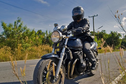 Motorcycle crash victim urges lawmakers to maintain helmet bill.