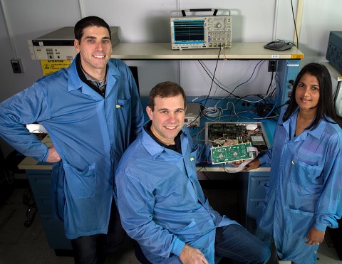 Jared Lucey, Jeffrey Piepmeier, and Priscilla Mohammed, a research engineer at Morgan State University, are developing a new CubeSat mission to test RFI-mitigation strategies. They are shown here with a testbed for testing mitigation algorithms. (Bill Hrybyk/NASA)