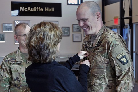 Lt. Col. Cory Mulhern, a liaison officer for the 101st Airborne Division (Air Assault), smiles at his daughter, Sierra, as she pins on his rank during his promotion ceremony in the division headquarters, Fort Campbell, Ky., Feb. 11, 2016. (Sgt. 1st Class Nathan Hoskins 101st Airborne Division Public Affairs) Lt. Col. Cory Mulhern, a liaison officer for the 101st Airborne Division (Air Assault), smiles at his daughter, Sierra, as she pins on his rank during his promotion ceremony in the division headquarters, Fort Campbell, Ky., Feb. 11, 2016. (Sgt. 1st Class Nathan Hoskins 101st Airborne Division Public Affairs)