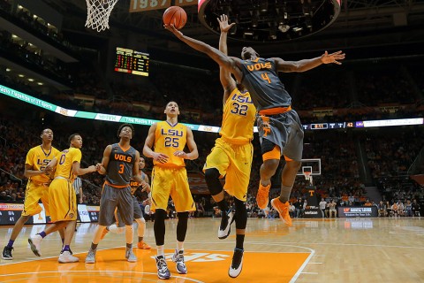 Tennessee Volunteers forward Armani Moore (4) shoots the ball past LSU Tigers forward Craig Victor II (32) at Thompson-Boling Arena. The Volunteers won 81 to 65. (Randy Sartin-USA TODAY Sports)