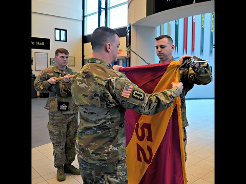 Soldiers, friends and family members gather at Fort Campbell, KY, to bid farewell to members of the 52d Ordnance Group (Explosive Ordnance Disposal (EOD)) during their Casing of the Colors Ceremony on March 1st. During this Army traditional event, Col. Mark Faria, the group’s commander, furled the 52nd EOD’s colors before sheathing and casing it symbolizing the movement of the group to the Middle East, their new theater of operation. (20th CBRNE Command) Soldiers, friends and family members gather at Fort Campbell, KY, to bid farewell to members of the 52d Ordnance Group (Explosive Ordnance Disposal (EOD)) during their Casing of the Colors Ceremony on March 1st. During this Army traditional event, Col. Mark Faria, the group’s commander, furled the 52nd EOD’s colors before sheathing and casing it symbolizing the movement of the group to the Middle East, their new theater of operation. (20th CBRNE Command)