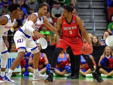 Austin Peay Governors center Chris Horton (5) handles the ball against Kansas Jayhawks forward Landen Lucas (33) during the first half in the first round of the 2016 NCAA Tournament at Wells Fargo Arena. (Steven Branscombe-USA TODAY Sports)