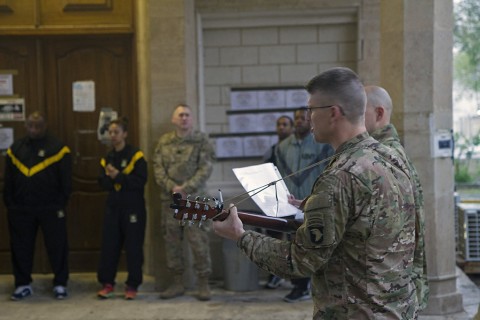 Lt. Col. David A. Bowlus, Combined Joint Force Land Component Command – Operation Inherent Resolve chaplain, plays guitar for Soldiers at an Easter sunrise service in Baghdad, Iraq, March 27, 2016. (U.S. Army photo by Sgt. Katie Eggers)