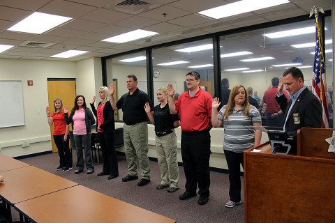 Montgomery County Sheriff John Fuson swears in Taylor Blagg, Jennie Esquilin, Ashley Hicks-Castanon, Craig Kay, Collen McGrath, Daniel Trimble, and Tasha Whitehead.