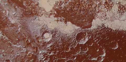 This enhanced color view of Pluto's surface diversity was created by merging Ralph/Multispectral Visible Imaging Camera (MVIC) color imagery (650 meters or 2,132 feet per pixel) with Long Range Reconnaissance Imager panchromatic imagery (230 meters or 755 feet per pixel). At lower right, ancient, heavily cratered terrain is coated with dark, reddish tholins. At upper right, volatile ices filling the informally named Sputnik Planum have modified the surface, creating a chaos-like array of blocky mountains. Volatile ice also occupies a few nearby deep craters, and in some areas the volatile ice is pocked with arrays of small sublimation pits. (NASA/JHUAPL/SwRI) This enhanced color view of Pluto's surface diversity was created by merging Ralph/Multispectral Visible Imaging Camera (MVIC) color imagery (650 meters or 2,132 feet per pixel) with Long Range Reconnaissance Imager panchromatic imagery (230 meters or 755 feet per pixel). At lower right, ancient, heavily cratered terrain is coated with dark, reddish tholins. At upper right, volatile ices filling the informally named Sputnik Planum have modified the surface, creating a chaos-like array of blocky mountains. Volatile ice also occupies a few nearby deep craters, and in some areas the volatile ice is pocked with arrays of small sublimation pits. (NASA/JHUAPL/SwRI)