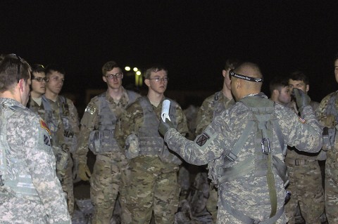 A crew chief with Alpha Company, 2nd Battalion (Assault), 10th Aviation Brigade, 10th Mountain Division, briefs 1st Battalion, 506th Infantry Regiment, 1st Brigade Combat Team, 101st Airborne Division (Air Assault) Soldiers at a safety brief during load out for an air assault mission Feb. 28, 2016, at Hangar 9, Fort Campbell, Ky. (U.S. Army photo by Staff Sgt. Jesse Anderla, 1st Brigade Combat Team, 101st Airborne Division (Air Assault) Public Affairs)