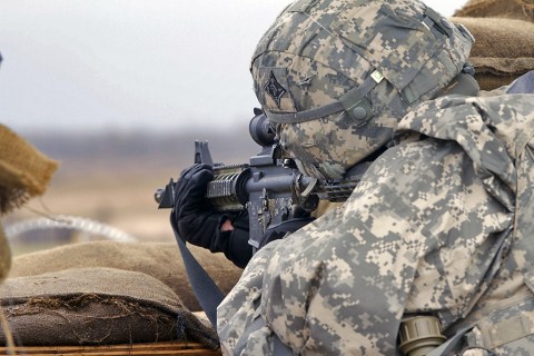 A Soldier from the 101st Financial Management Support Unit, 101st Sustainment Brigade, 101st Airborne Division (Air Assault), calmly watches his sector during the battalions defense live fire exercise on Fort Campbell, Ky., March 31, 2016. (U.S. Army Sgt. Neysa Canfield, 101st Sustainment Brigade Public Affairs)