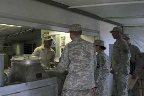 Pfc. Kallin D. Jones, a food service specialist with Headquarters and Headquarters Company, 101st Special Troops Battalion, 101st Sustainment Brigade, 101st Airborne Division (Air Assault), serves his fellow “Lifeliners” a hot meal during the battalions defense live fire exercise on Fort Campbell, Ky., March 30, 2016. (U.S. Army Sgt. Neysa Canfield, 101st Sustainment Brigade Public Affairs)