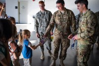 Girl Scouts give Packages of Cookies to Fort Campbell soldiers.