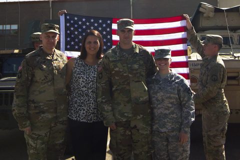 Col. Doyle Lassitter, Christine Lassitter, Cpl. Matthew Lassitter, and Cpl. Kristie Lassitter pose for a family group picture after Cpl. Lassitter's re-enlistment ceremony on Fort Campbell, Ky., April 18, 2016. (Sgt. Neysa Canfield, 101st Sustainment Brigade, 101st Airborne Division (AA) Public Affairs)