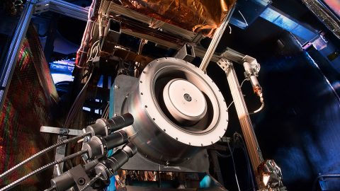 Advanced solar electric propulsion will be needed for future human expeditions into deep space, including to Mars. Shown here is a 13-kilowatt Hall thruster being evaluated at NASA's Glenn Research Center in Cleveland. Hall thrusters trap electrons in a magnetic field and use them to ionize the onboard propellant. It uses 10 times less propellant than equivalent chemical rockets. (NASA)