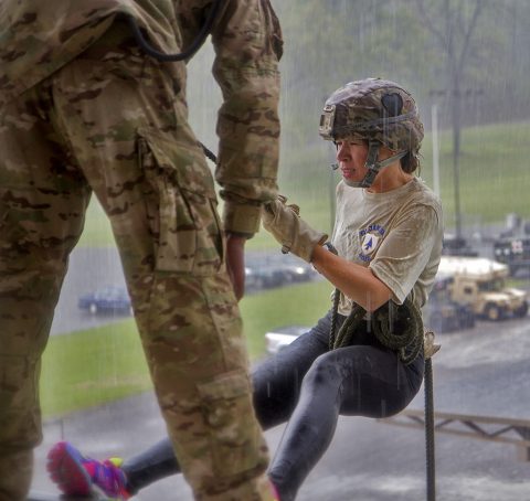 Erica Holmgren, wife of Sgt. 1st Class Adam Holmgren, a Soldier in 1st Battalion, 26th Infantry Regiment, 2nd Brigade Combat Team,101st Airborne Division prepares to bound as she is coached on proper rappelling techniques at by an instructor at the Sabalauski Air Assault School, April 21, 2016. (1st Lt. Daniel I. Johnson, 2nd Brigade Combat Team, 101st Airborne Division (Air Assault) UPAR)